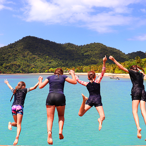 Kids jumping off the jetty on Dunk Island on a school camp